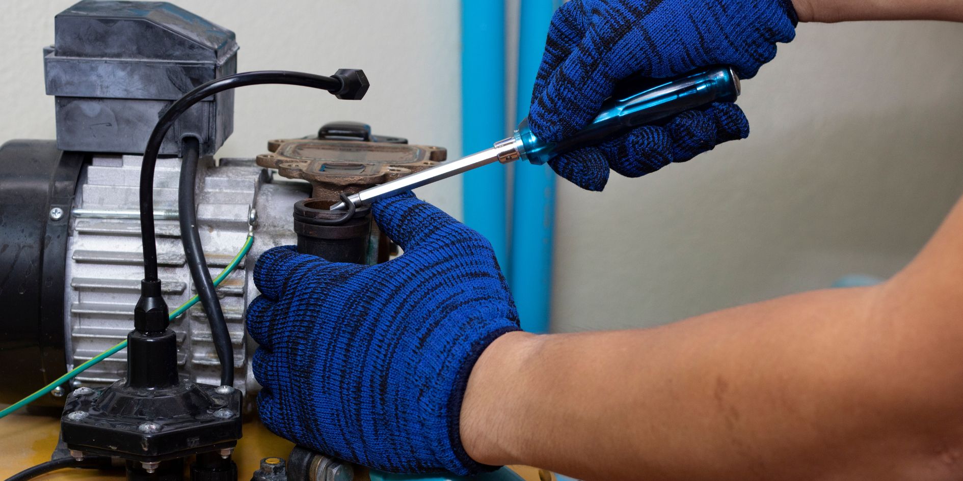 pump-maintenance-in-sydney Plumber doing pump maintenance in Sydney.